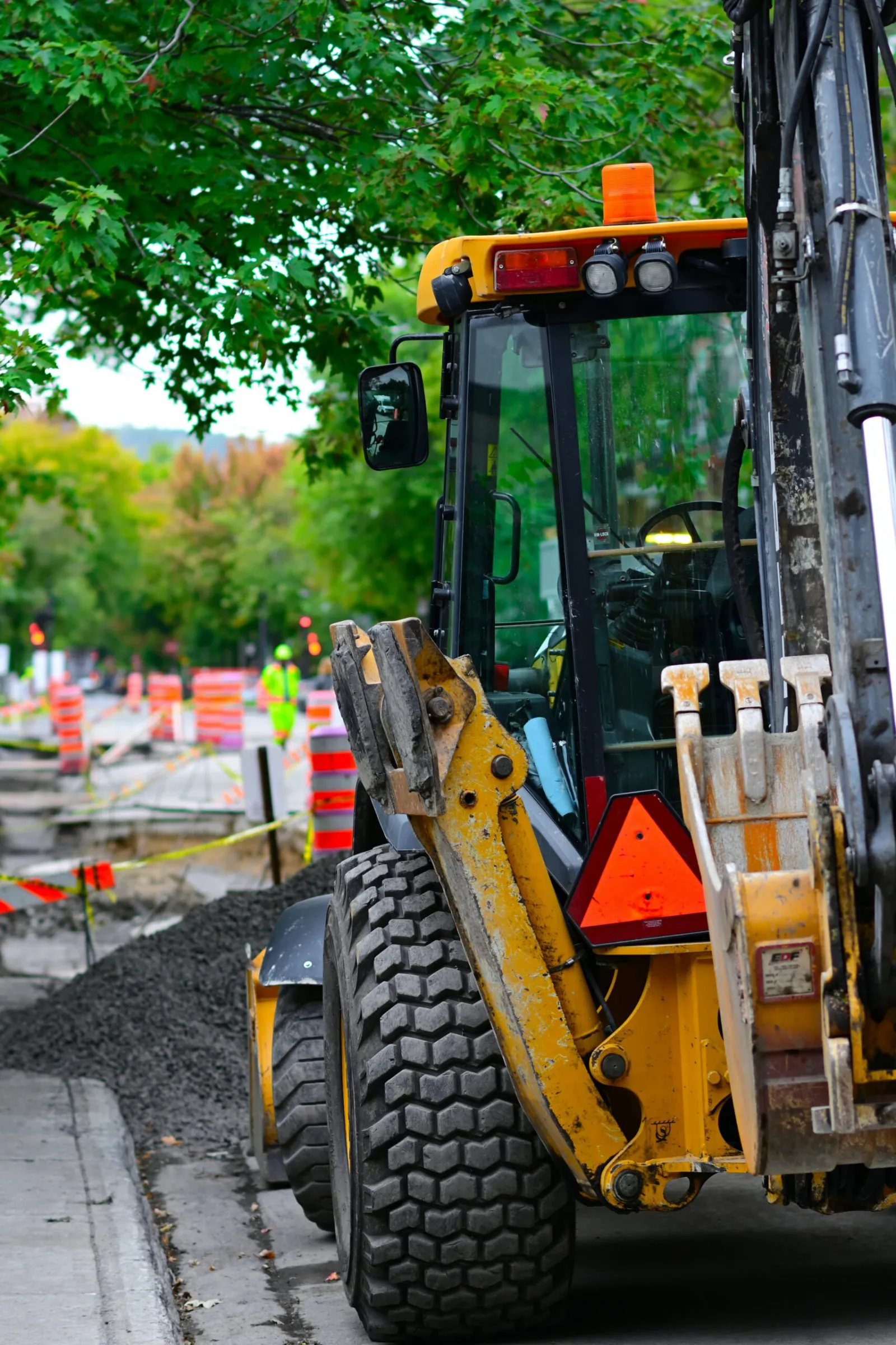 Commercial Asphalt Projects in Oak Hill Nashville Excavator and safety cones on a commercial site being prepared for new asphalt paving