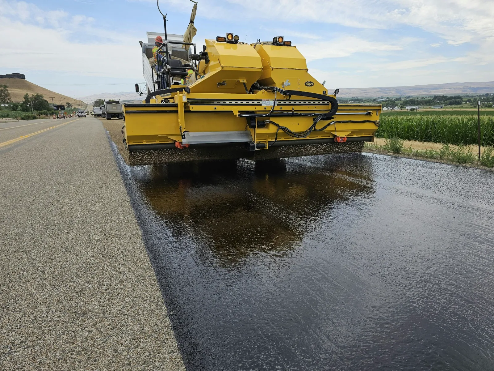 Sealcoating Services in Oak Hill Nashville TN Sealcoating truck spraying protective sealer on asphalt pavement - sealcoating services in Oak Hill